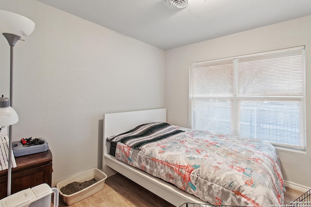 bedroom featuring wood-type flooring