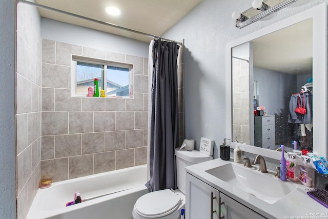 full bathroom featuring vanity, shower / tub combo, and toilet