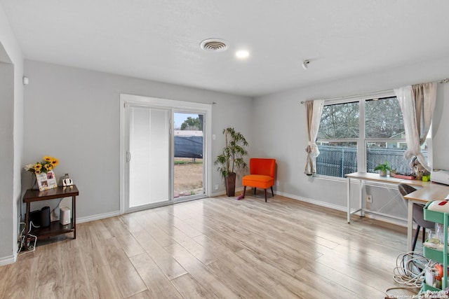 sitting room with light hardwood / wood-style flooring