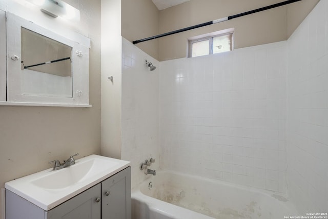 bathroom featuring vanity and washtub / shower combination