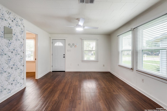 foyer with dark hardwood / wood-style floors and ceiling fan