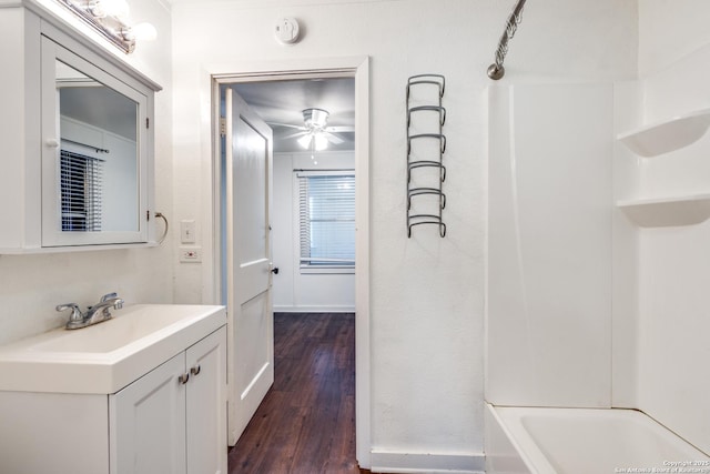 bathroom featuring ceiling fan, wood-type flooring, and vanity