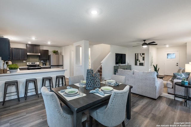 dining space featuring dark hardwood / wood-style floors and ceiling fan