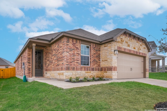 view of front of home featuring a garage and a front lawn