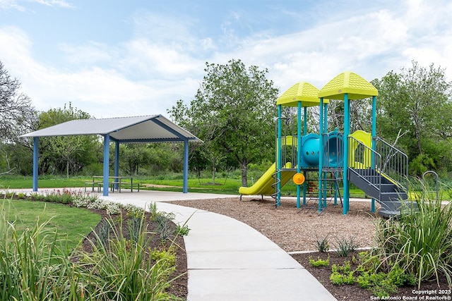 view of playground with a lawn