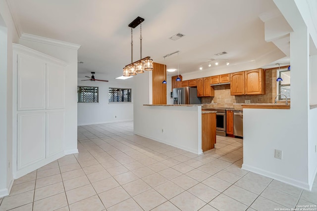 kitchen featuring backsplash, light tile patterned floors, ceiling fan, kitchen peninsula, and stainless steel appliances