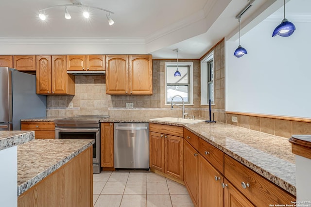 kitchen featuring light tile patterned flooring, sink, decorative light fixtures, appliances with stainless steel finishes, and decorative backsplash