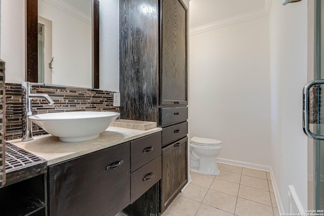 bathroom with tasteful backsplash, crown molding, tile patterned floors, and vanity