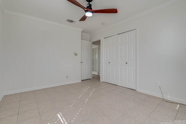 unfurnished bedroom featuring crown molding, a closet, and ceiling fan