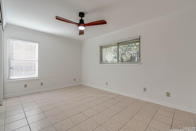 tiled empty room featuring crown molding and ceiling fan