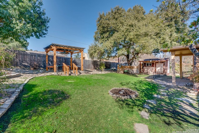 view of yard featuring a pergola and a fire pit