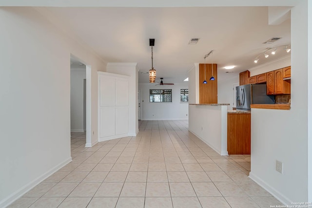 kitchen with pendant lighting, stainless steel fridge, light tile patterned floors, ceiling fan, and kitchen peninsula