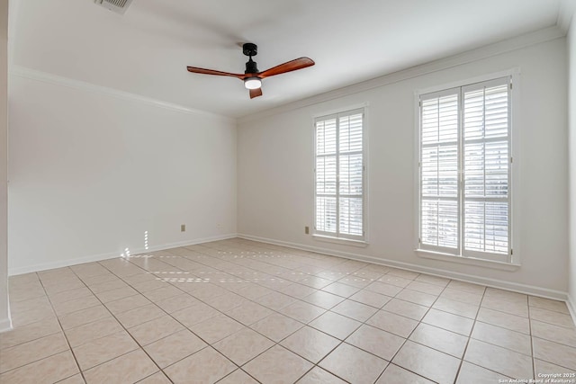 empty room with light tile patterned flooring, ceiling fan, and crown molding