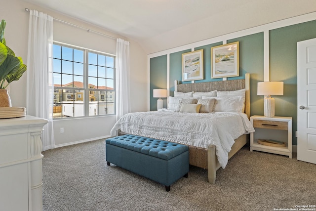 bedroom featuring carpet flooring and vaulted ceiling