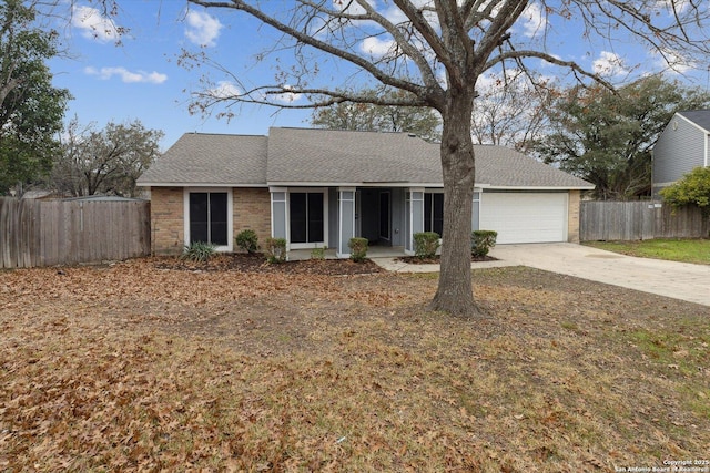 ranch-style house featuring a garage