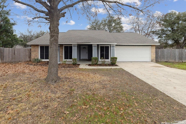 ranch-style home featuring a garage