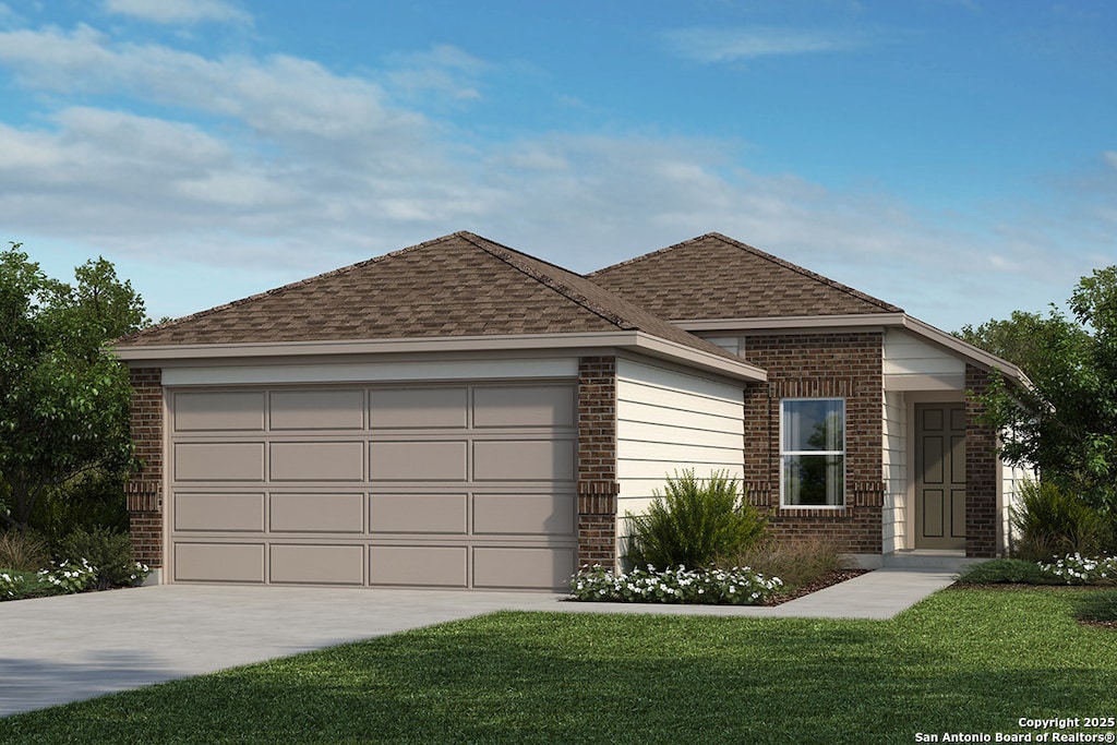 view of front of property featuring a garage and a front yard