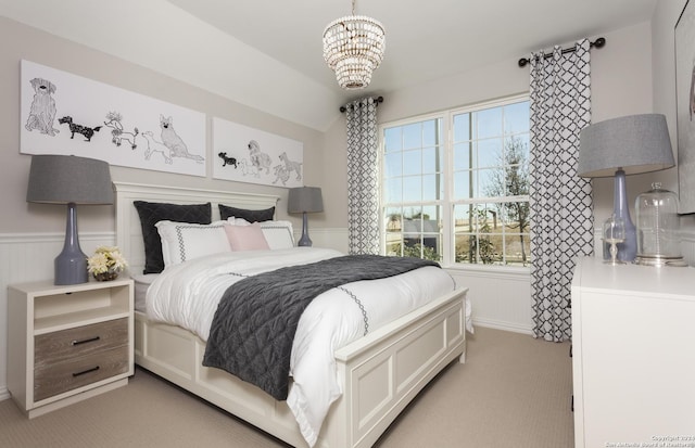 carpeted bedroom featuring a chandelier