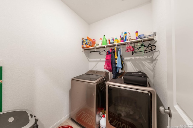 laundry room featuring washer and clothes dryer