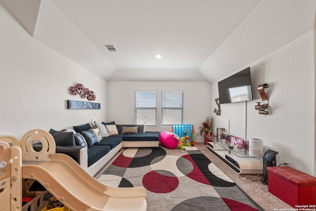 carpeted living room featuring lofted ceiling and a textured ceiling