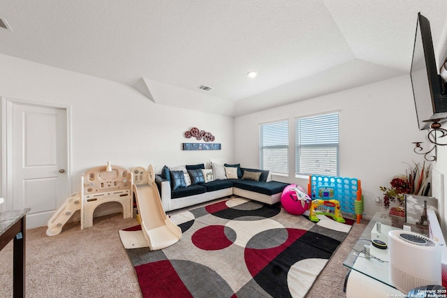 living room featuring a tray ceiling, vaulted ceiling, and carpet