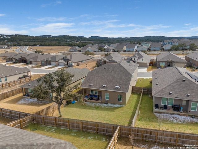 birds eye view of property with a mountain view