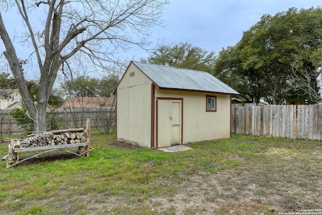 view of outdoor structure with a lawn