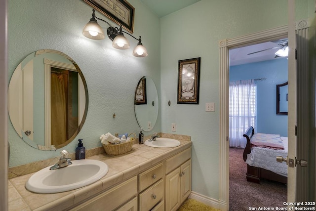 bathroom featuring vanity and ceiling fan