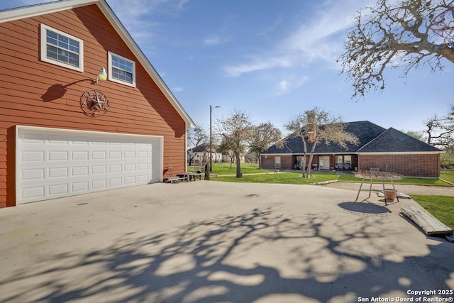 exterior space featuring a yard and a garage