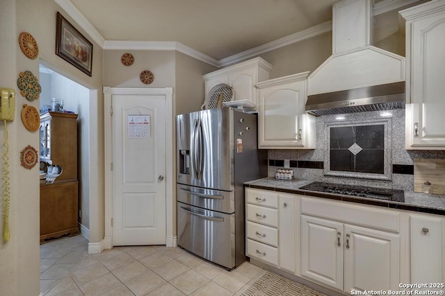 kitchen with backsplash, light tile patterned flooring, stainless steel fridge with ice dispenser, and white cabinets