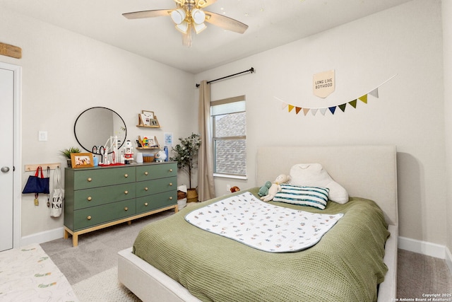 carpeted bedroom featuring ceiling fan