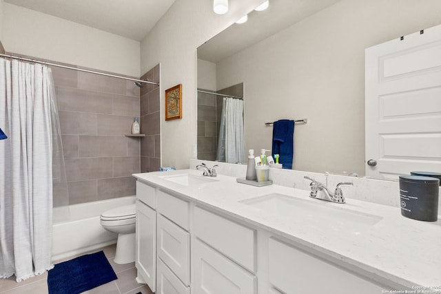 full bathroom featuring tile patterned flooring, vanity, toilet, and shower / bath combo with shower curtain