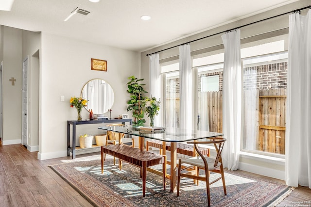 dining area with wood-type flooring