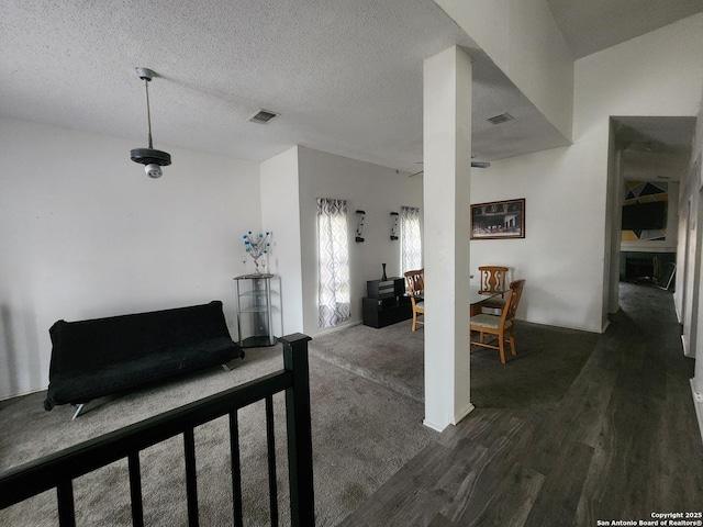 interior space featuring dark hardwood / wood-style floors and a textured ceiling