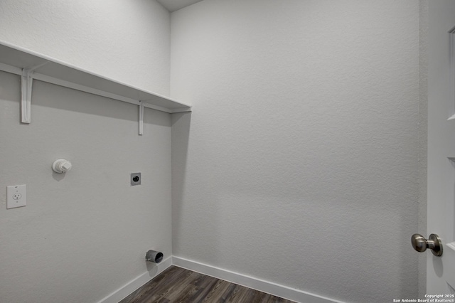 clothes washing area featuring laundry area, hookup for an electric dryer, dark wood finished floors, and baseboards