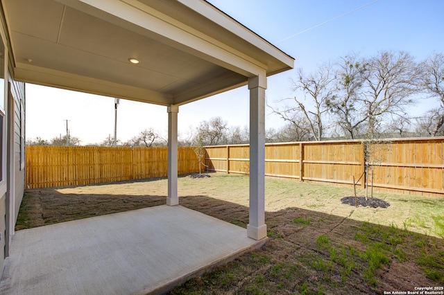 view of yard featuring a patio area and a fenced backyard