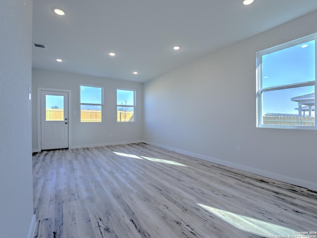 unfurnished room featuring light wood-type flooring