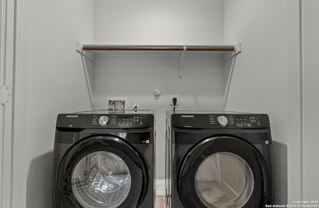 washroom with washer and clothes dryer