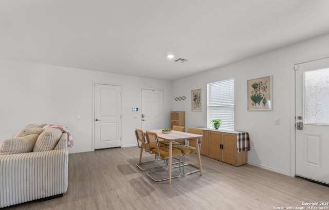 dining room featuring light hardwood / wood-style flooring