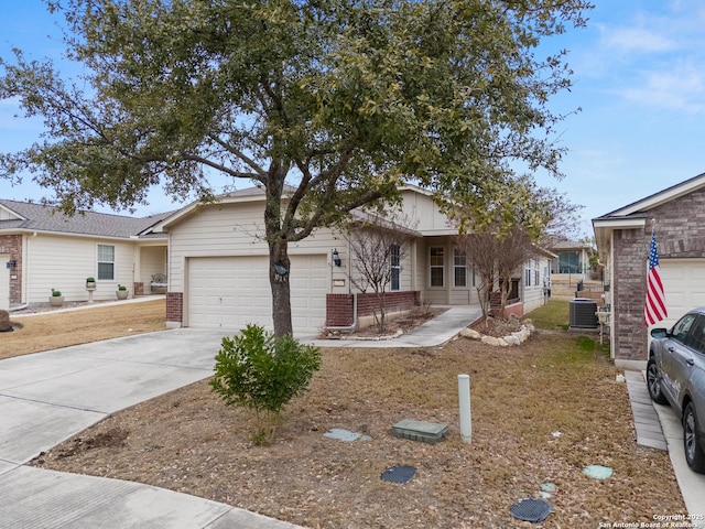 single story home with a garage and central air condition unit