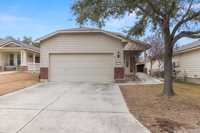 view of front of property with a garage and covered porch