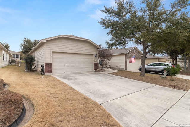 single story home featuring a garage and a front lawn