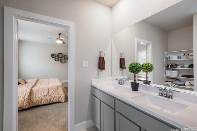 bathroom featuring ceiling fan and vanity