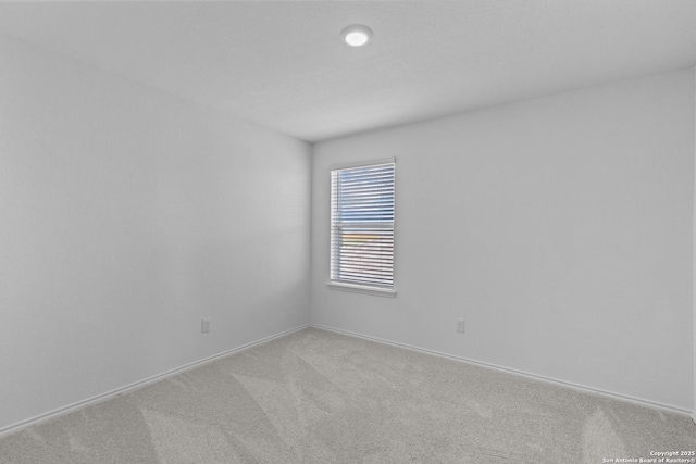 unfurnished room featuring carpet