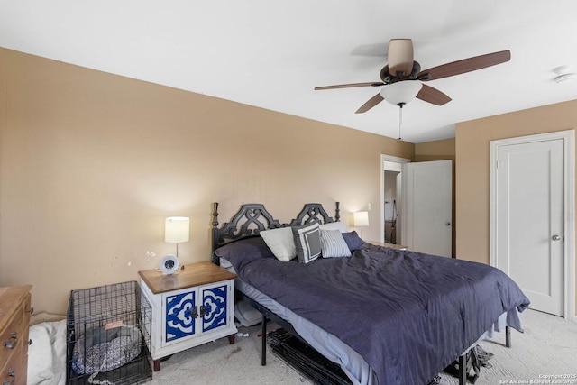 bedroom featuring light colored carpet and ceiling fan