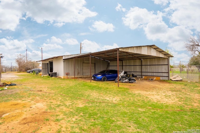 view of outdoor structure with a lawn