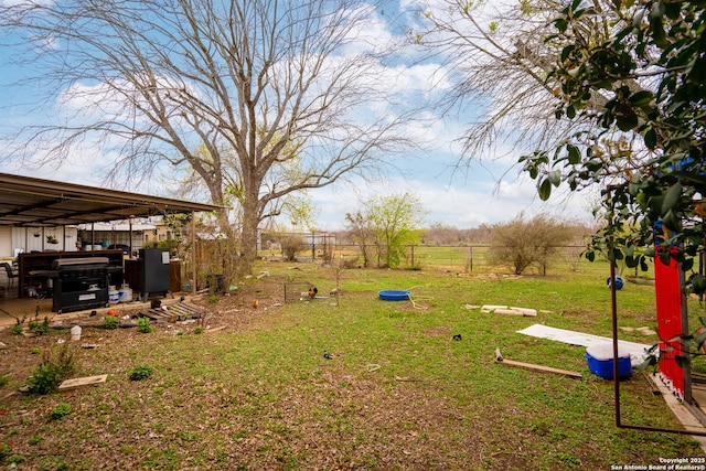 view of yard with a rural view