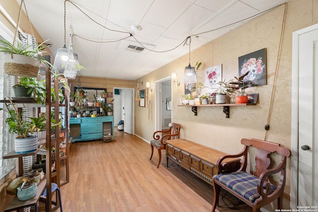 living area with hardwood / wood-style flooring