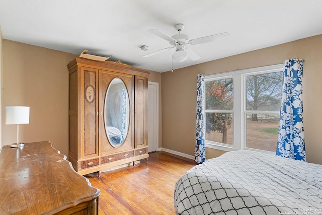 bedroom featuring light wood-type flooring and ceiling fan