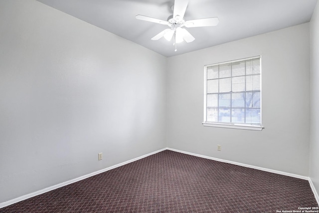 carpeted empty room with ceiling fan